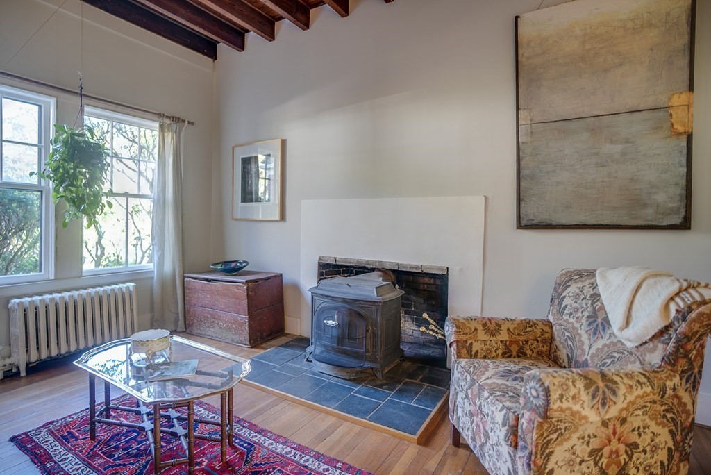 9 Addison Street Arlington, MA 02476 - Photo 14 of 41 a living room with furniture and a window