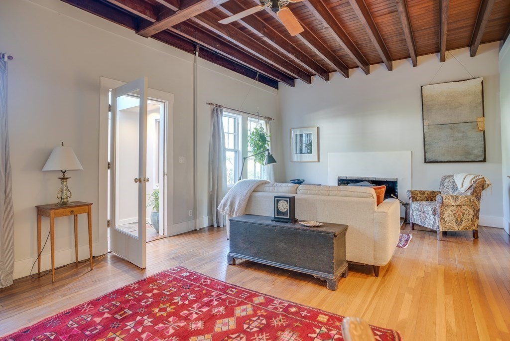 9 Addison Street Arlington, MA 02476 - Photo 15 of 41 a living room with furniture and a wooden floor