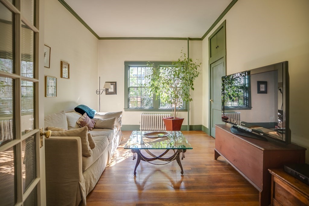 9 Addison Street Arlington, MA 02476 - Photo 21 of 41 a living room with furniture and a large window