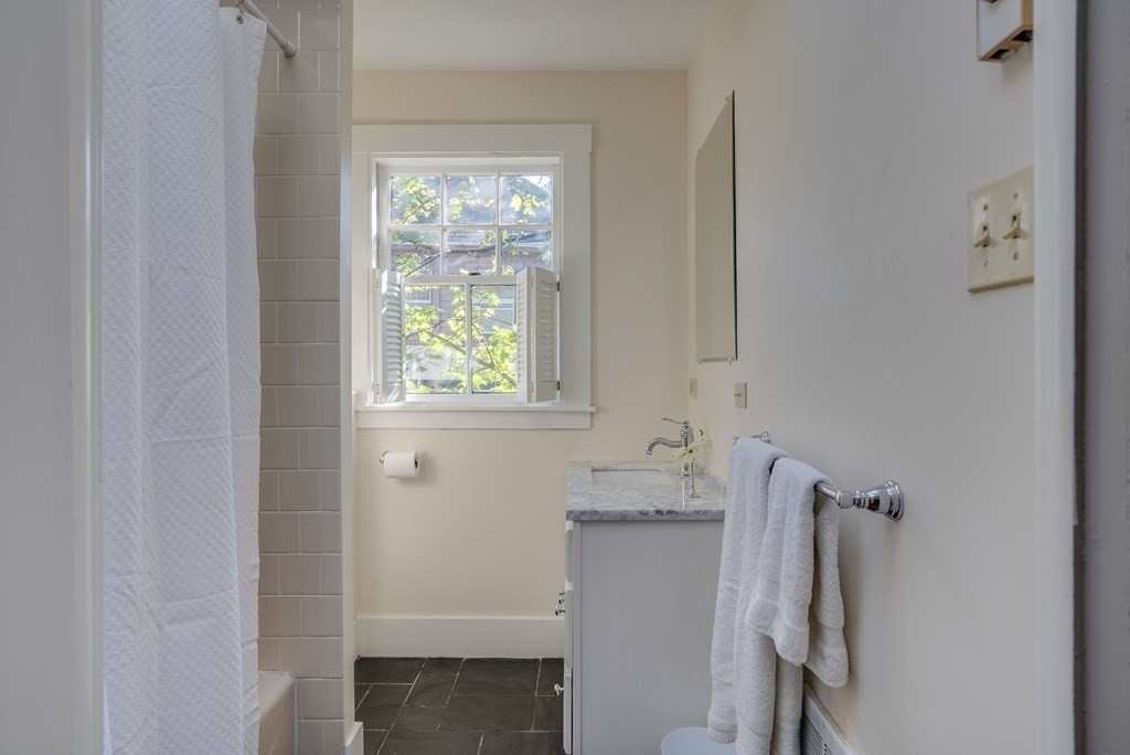 9 Addison Street Arlington, MA 02476 - Photo 23 of 41 a bathroom with a sink and a window