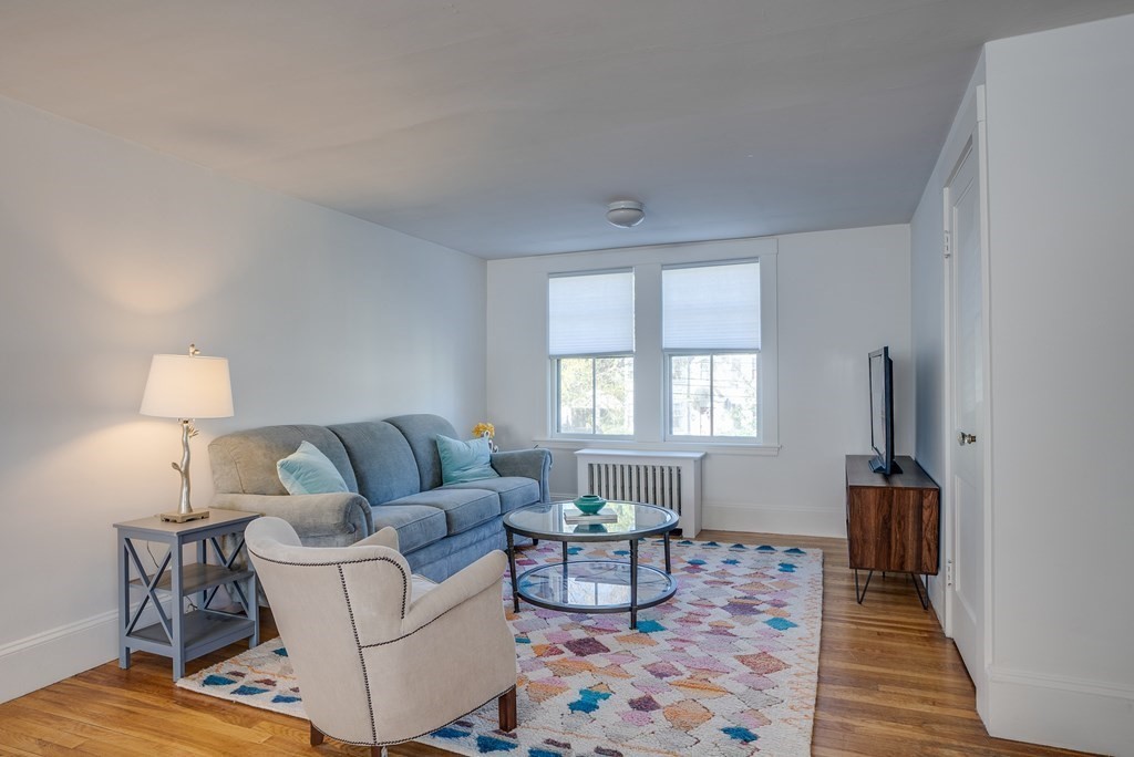 9 Addison Street Arlington, MA 02476 - Photo 26 of 41 a living room with furniture and a rug