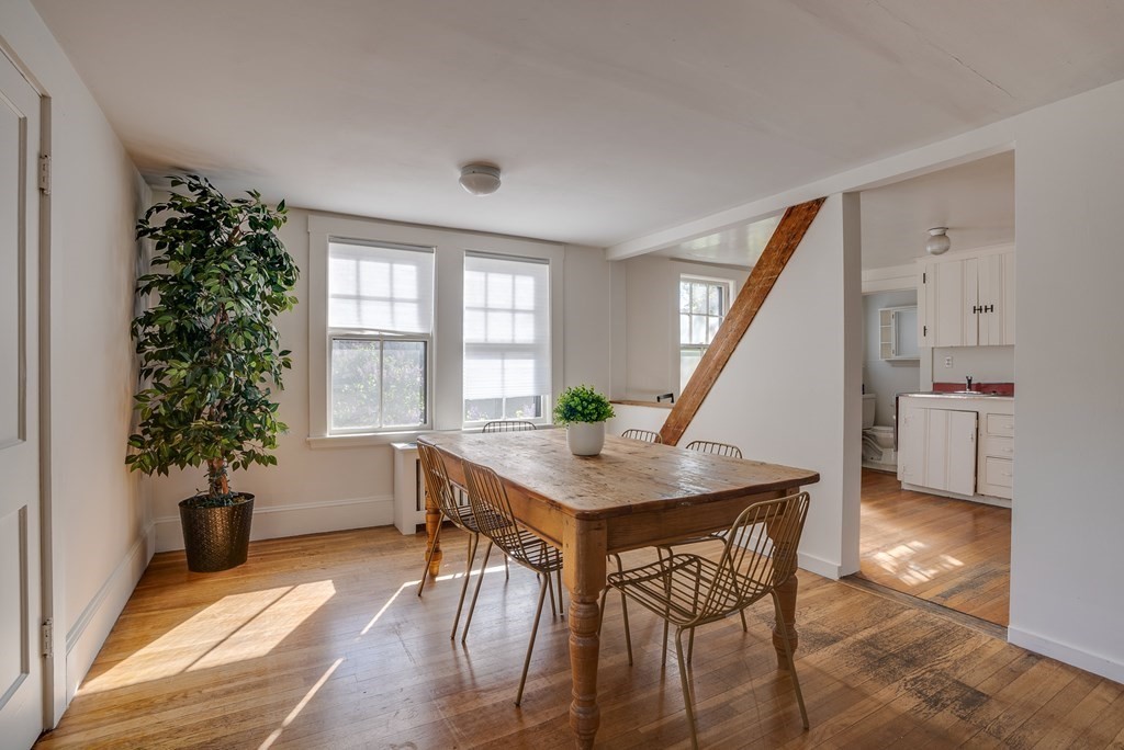 9 Addison Street Arlington, MA 02476 - Photo 29 of 41 a view of a livingroom with furniture window and wooden floor