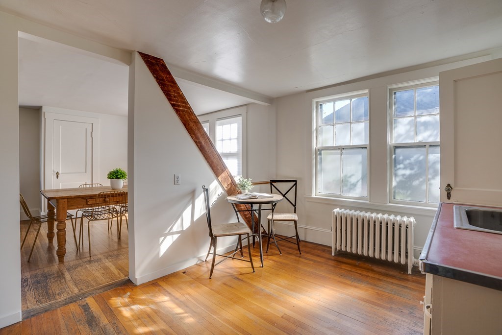 9 Addison Street Arlington, MA 02476 - Photo 30 of 41 a view of a livingroom with furniture and hardwood floor