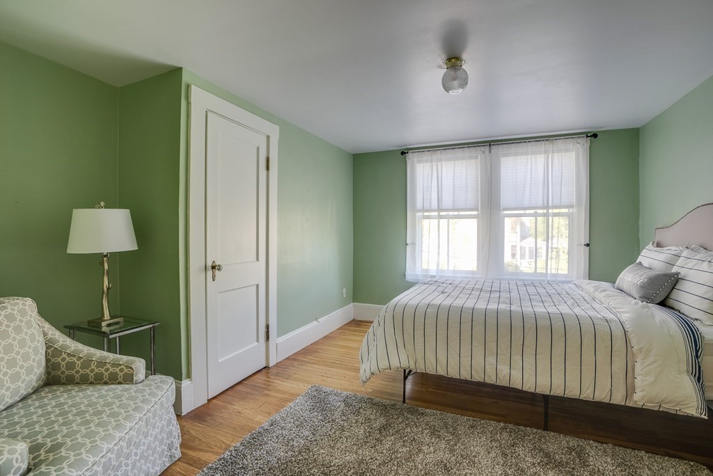 9 Addison Street Arlington, MA 02476 - Photo 33 of 41 a bedroom with a bed and a couch