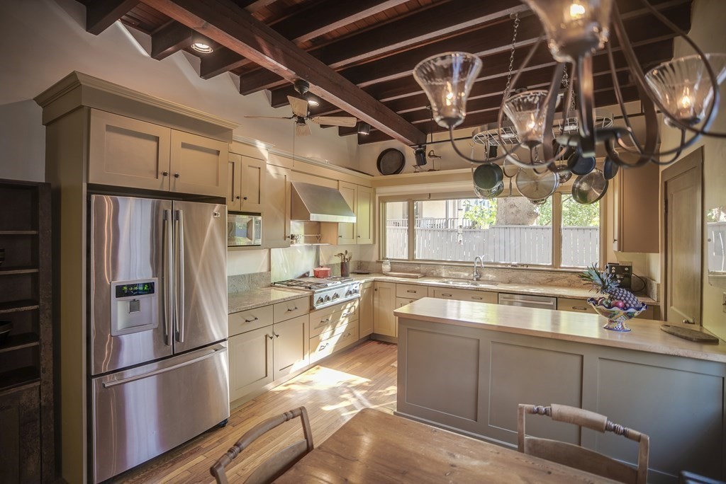 9 Addison Street Arlington, MA 02476 - Photo 5 of 41 a kitchen with granite countertop a refrigerator and a sink