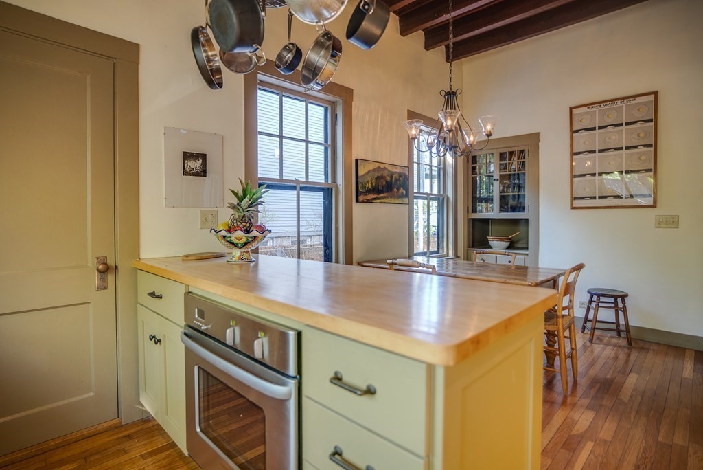 9 Addison Street Arlington, MA 02476 - Photo 8 of 41 a kitchen with stainless steel appliances granite countertop a sink and a refrigerator