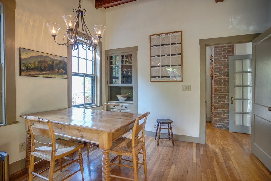9 Addison Street Arlington, MA 02476 - Photo 9 of 41 a view of a dining room with furniture and wooden floor