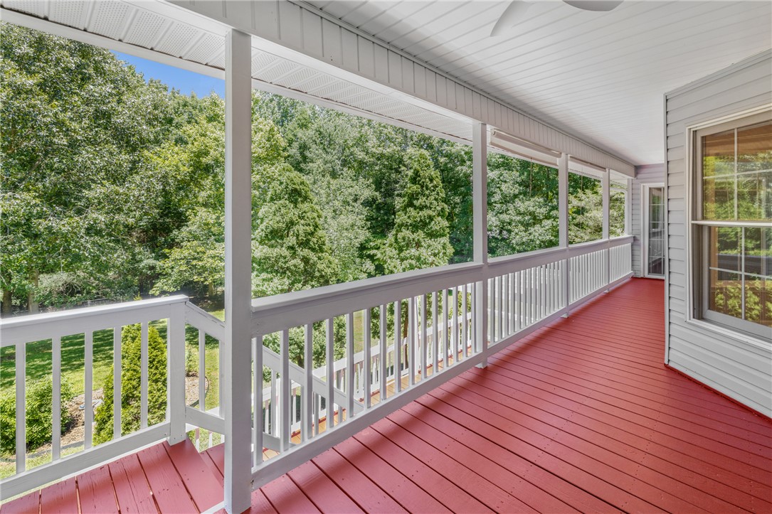 429 Burns Mill Road West Union, SC 29696 - Photo 32 of 49 A spacious covered porch with rich red flooring offers verdant treetop views.