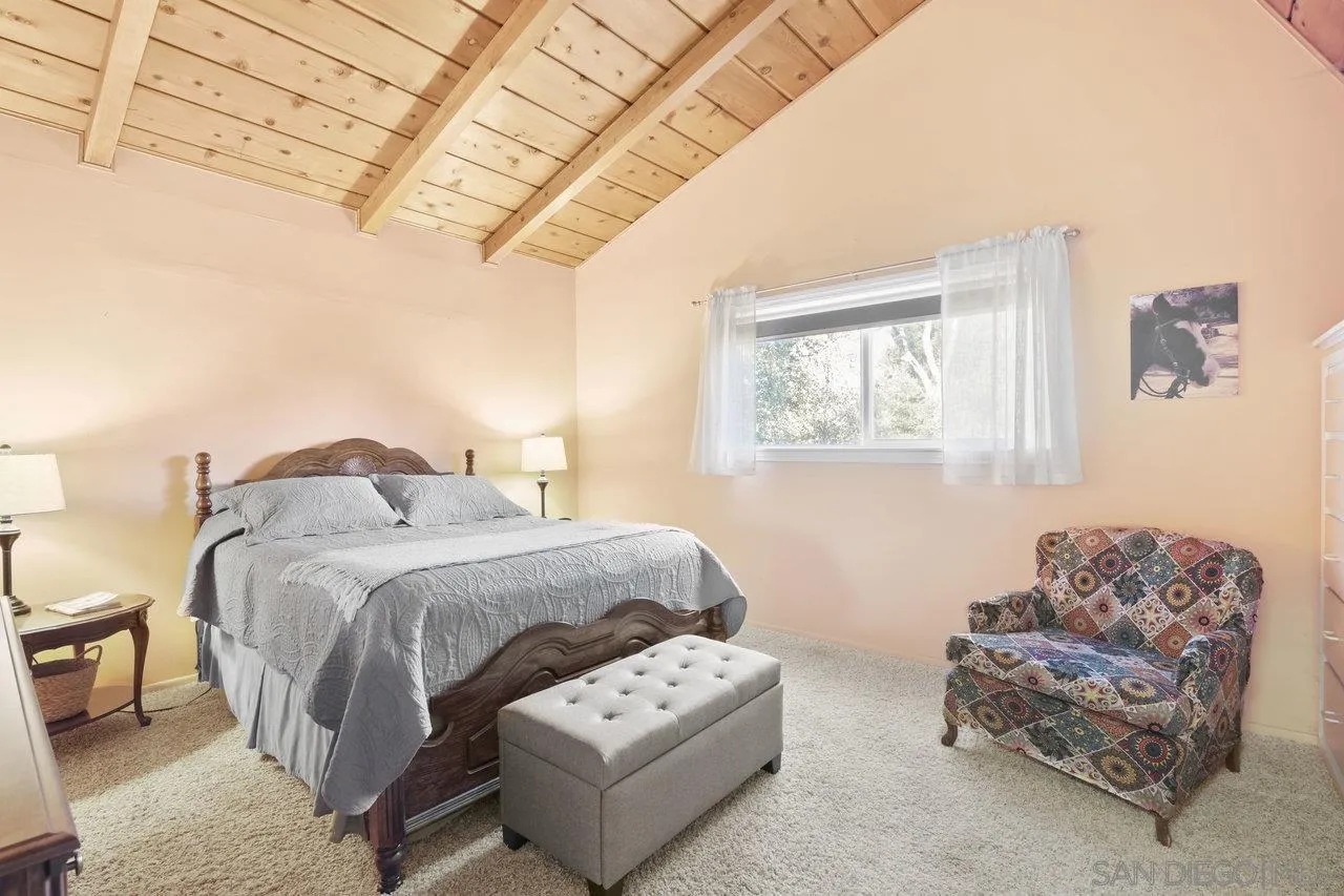 9018 Vernal Lane Descanso, CA 91916 - Photo 19 of 56 a bedroom with furniture and a window