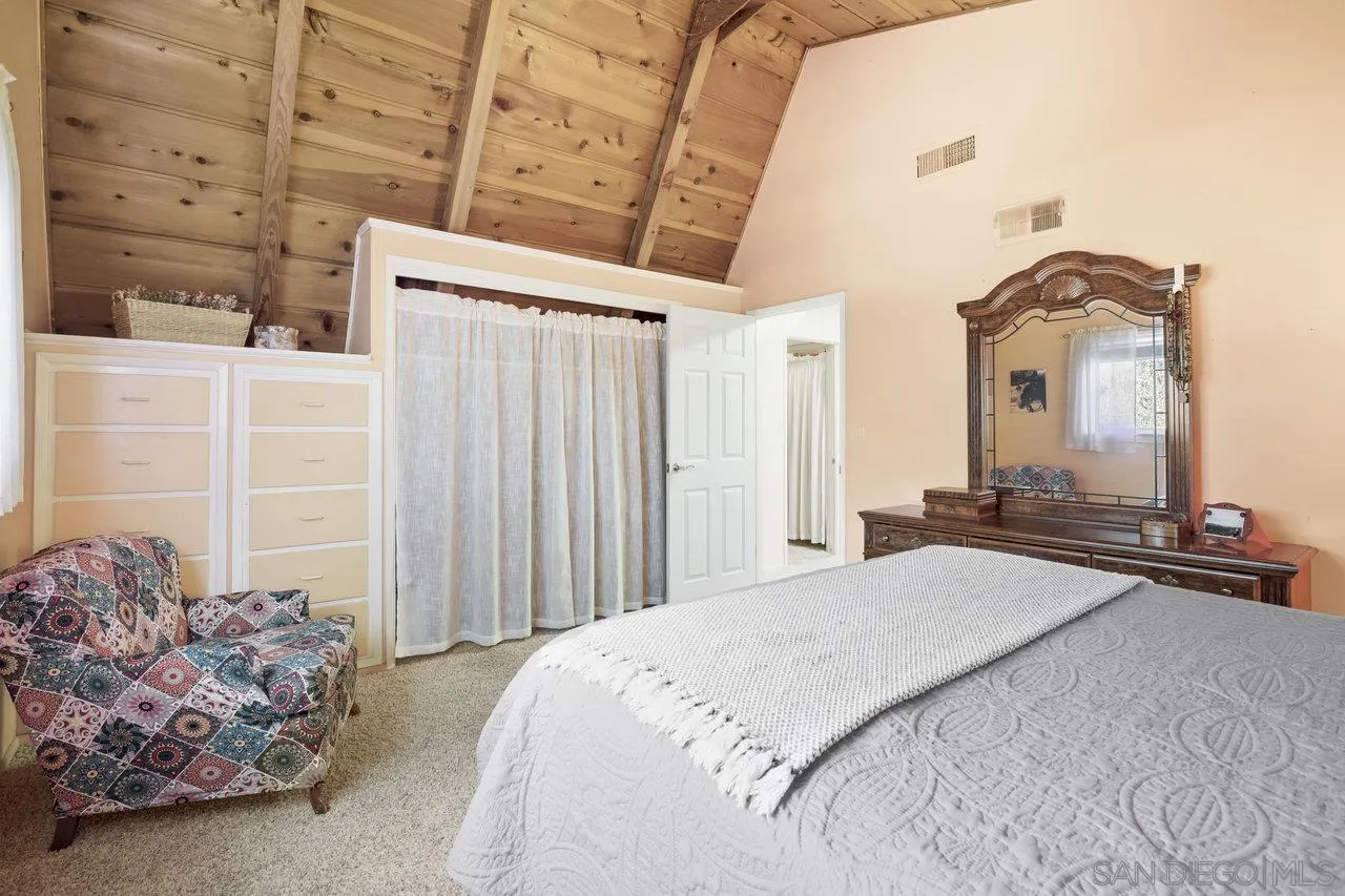 9018 Vernal Lane Descanso, CA 91916 - Photo 20 of 56 a bedroom with a bed and a mirror