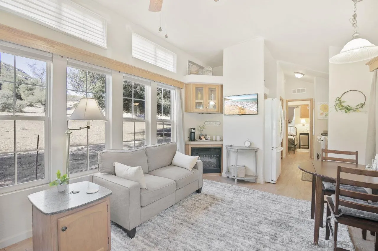9018 Vernal Lane Descanso, CA 91916 - Photo 34 of 56 a living room with furniture and a large window