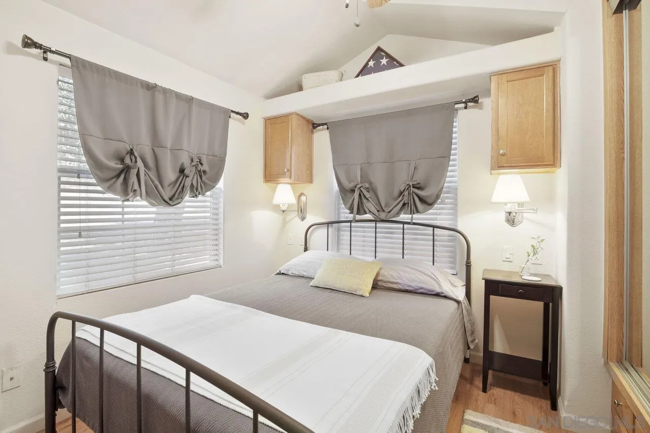 9018 Vernal Lane Descanso, CA 91916 - Photo 38 of 56 a bedroom with a bed and a window