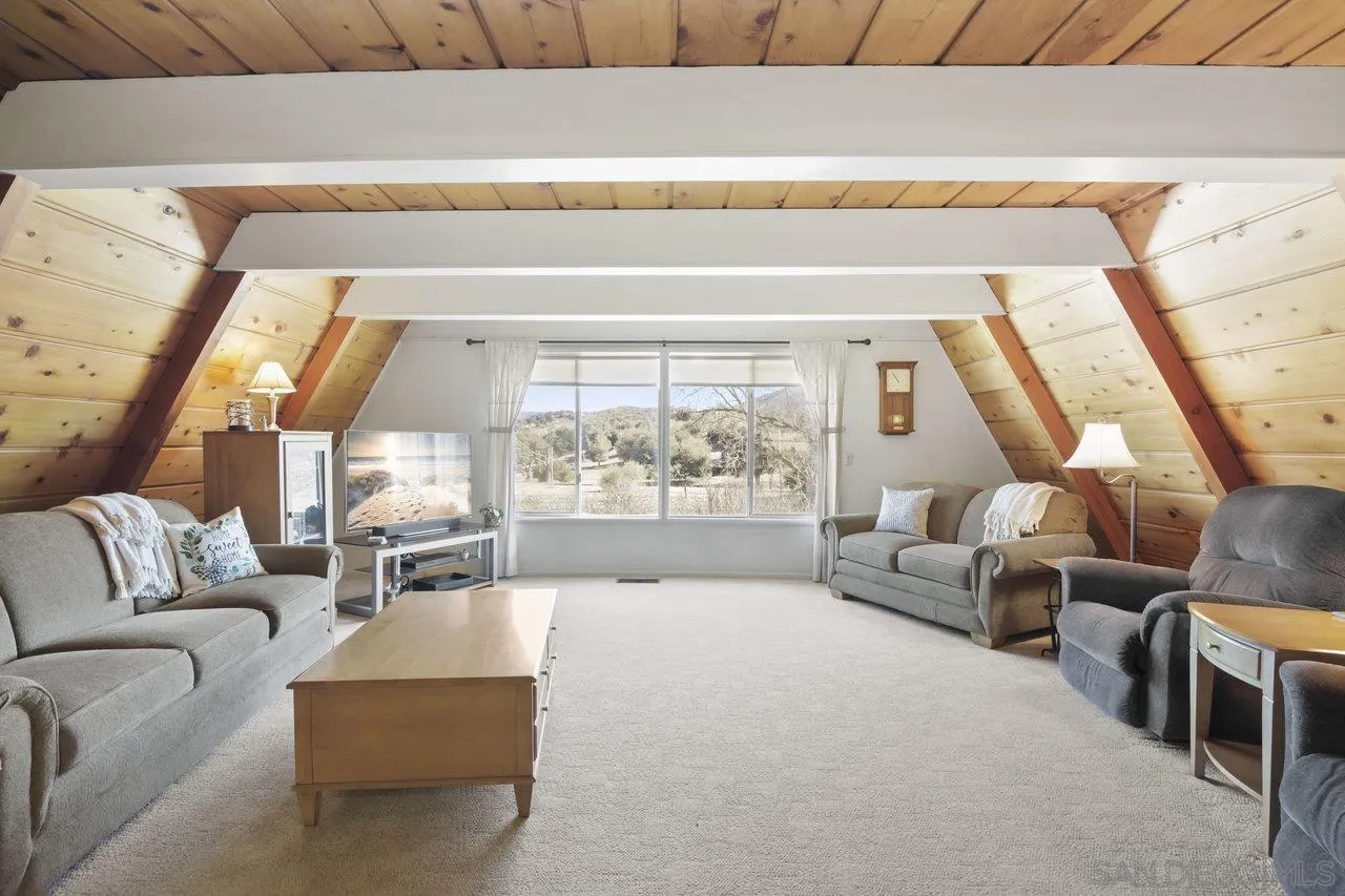 9018 Vernal Lane Descanso, CA 91916 - Photo 9 of 56 a living room with furniture and a large window