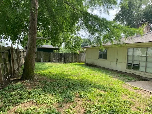 a backyard of a house with lots of green space