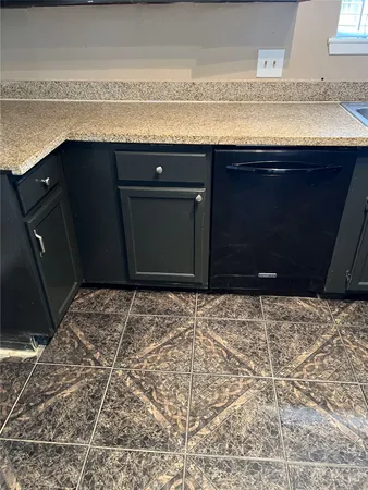 a room with a bed and a dresser