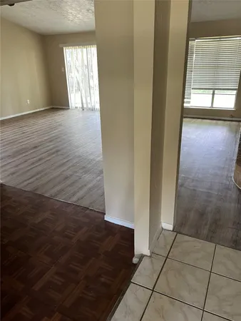 a view of an empty room and window