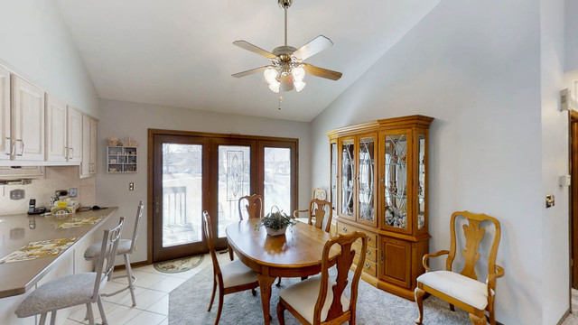 1870 Golfview Drive Bartlett, IL 60103 - Photo 4 of 15 a view of a dining room with furniture and window