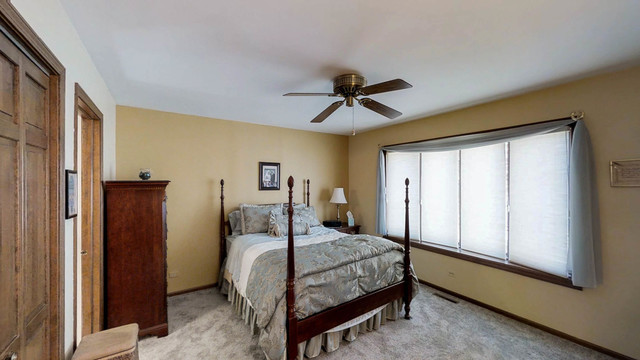1870 Golfview Drive Bartlett, IL 60103 - Photo 7 of 15 a bedroom with a bed and a window