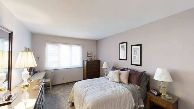 1870 Golfview Drive Bartlett, IL 60103 - Photo 9 of 15 a bedroom with bed and window