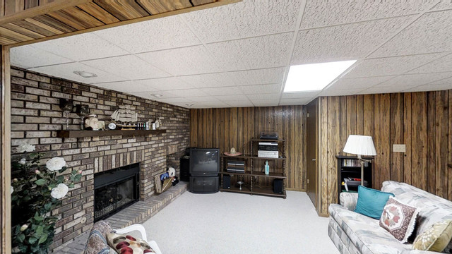 1870 Golfview Drive Bartlett, IL 60103 - Photo 10 of 15 a living room with furniture and a fireplace