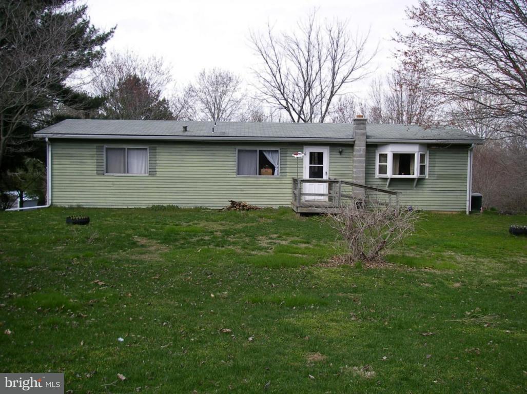 492 Kirks Mill Road Nottingham, PA 19362 - Photo 1 of 5 a front view of a house with a garden