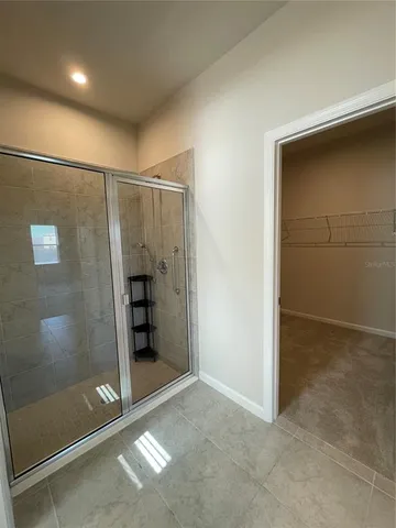 a bathroom with a toilet a sink and a window