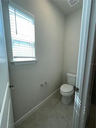 a bathroom with a double vanity sink and mirror
