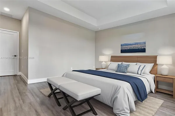 a bedroom with double bed and a window