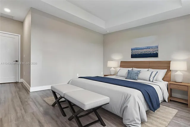 a view of a kitchen with wooden floor and a sink