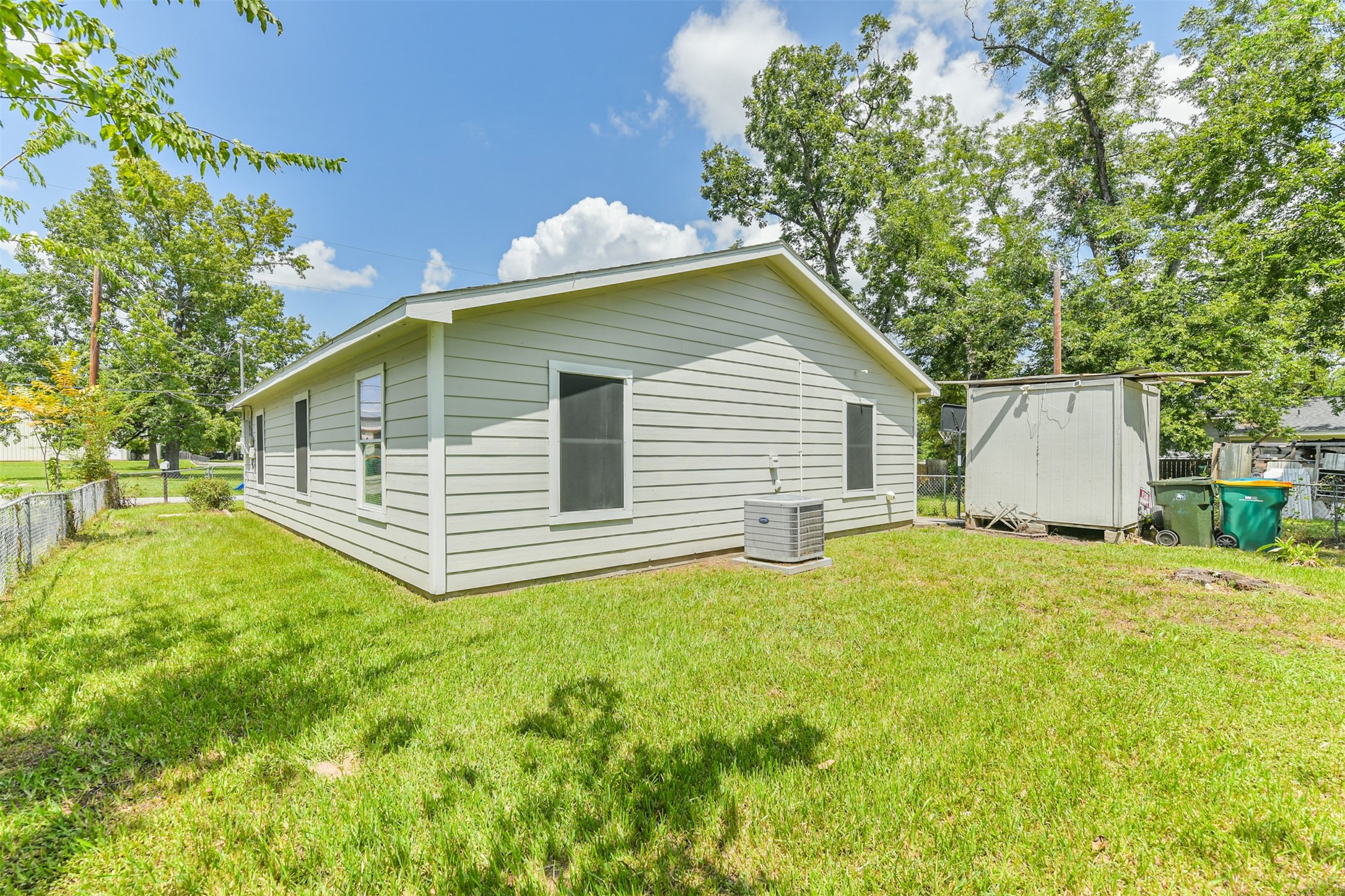 617 Avenue I Conroe, TX 77301 - Photo 18 of 19 Fully fenced yard with storage shed