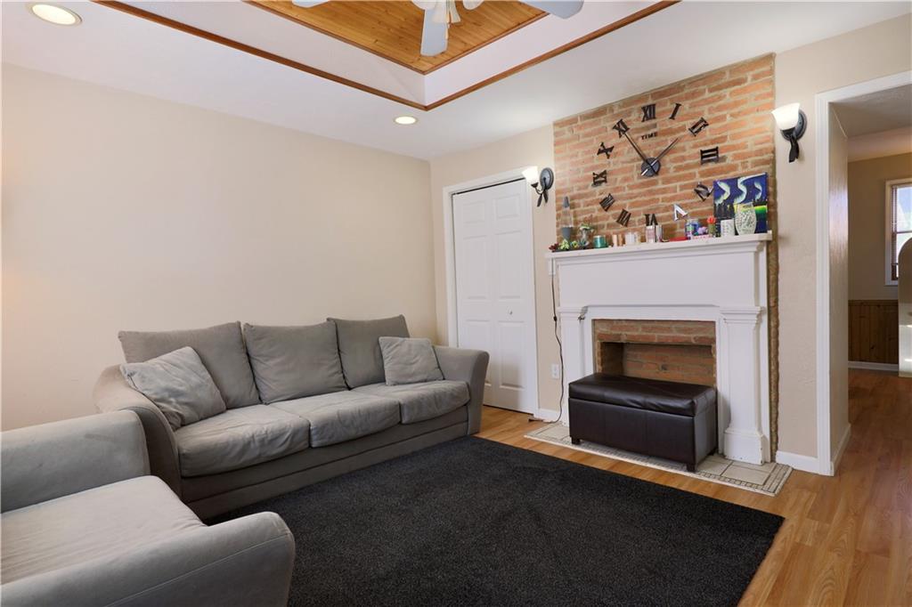 1923 Wharton Street Pittsburgh, PA 15203 - Photo 7 of 34 a living room with furniture and a fireplace