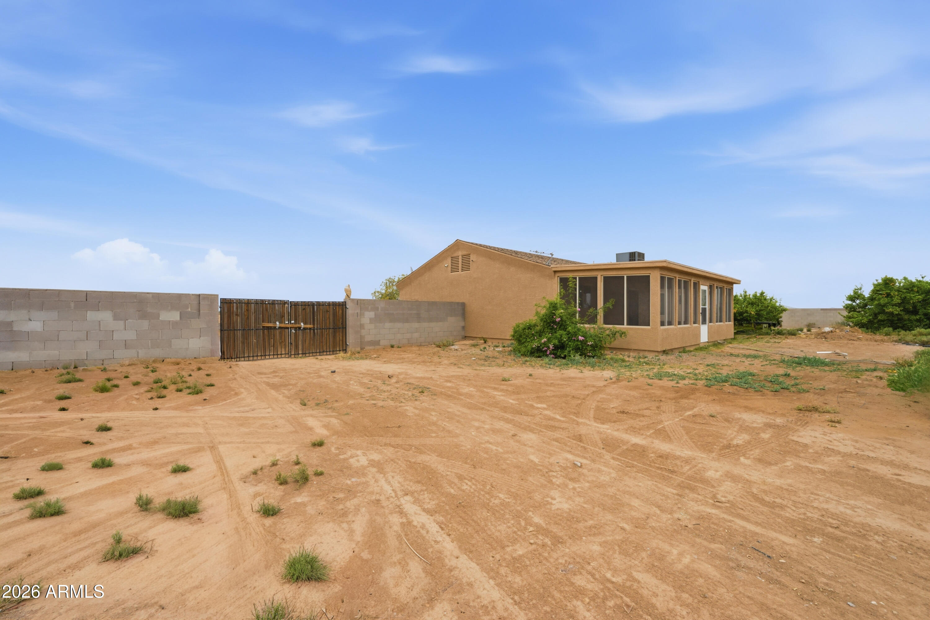 3527 East Batten Road Eloy, AZ 85131 - Photo 12 of 17 a house view with a wooden fence