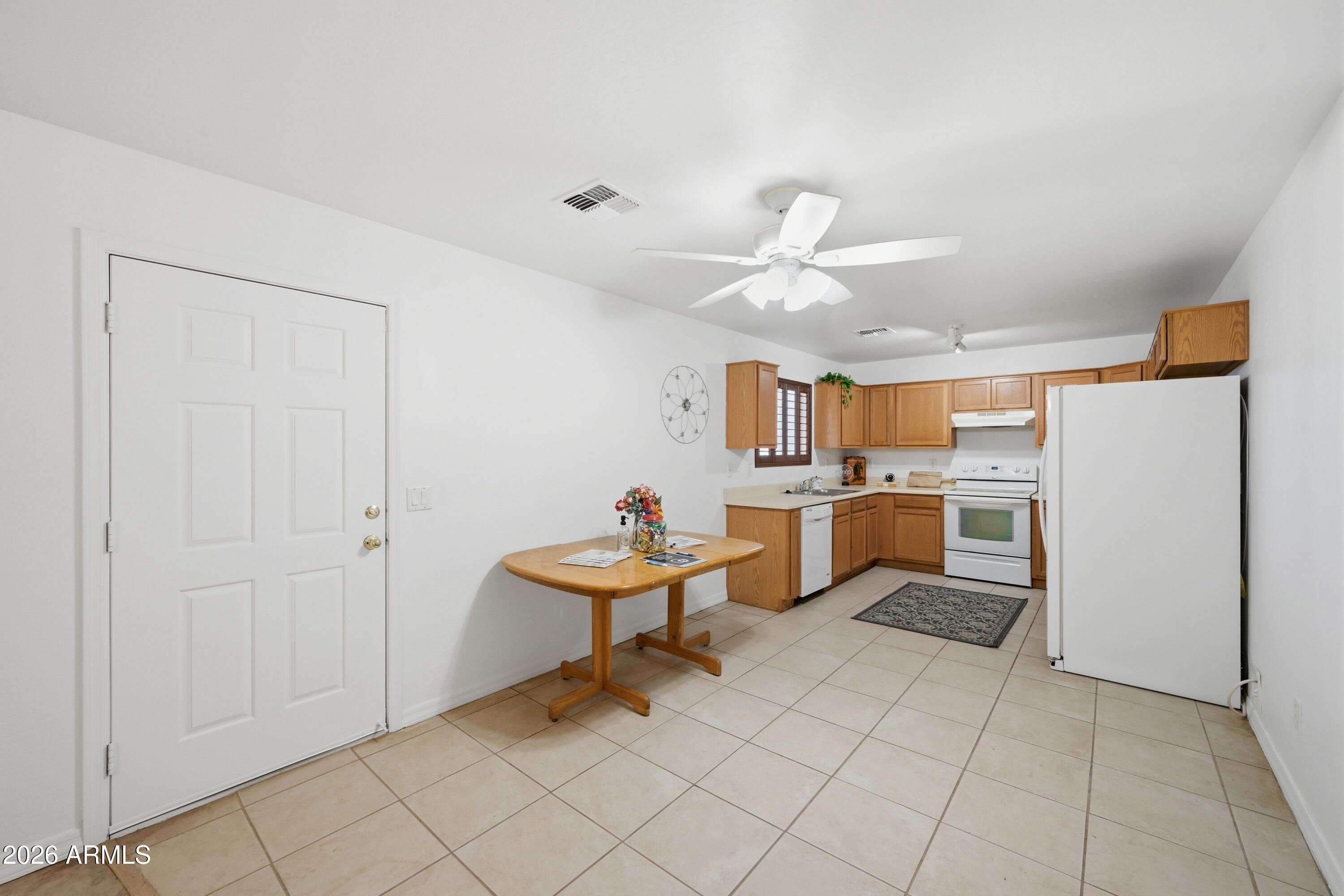 3527 East Batten Road Eloy, AZ 85131 - Photo 4 of 17 a open kitchen with cabinets and stainless steel appliances