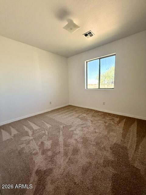3527 East Batten Road Eloy, AZ 85131 - Photo 7 of 10 an empty room with a window