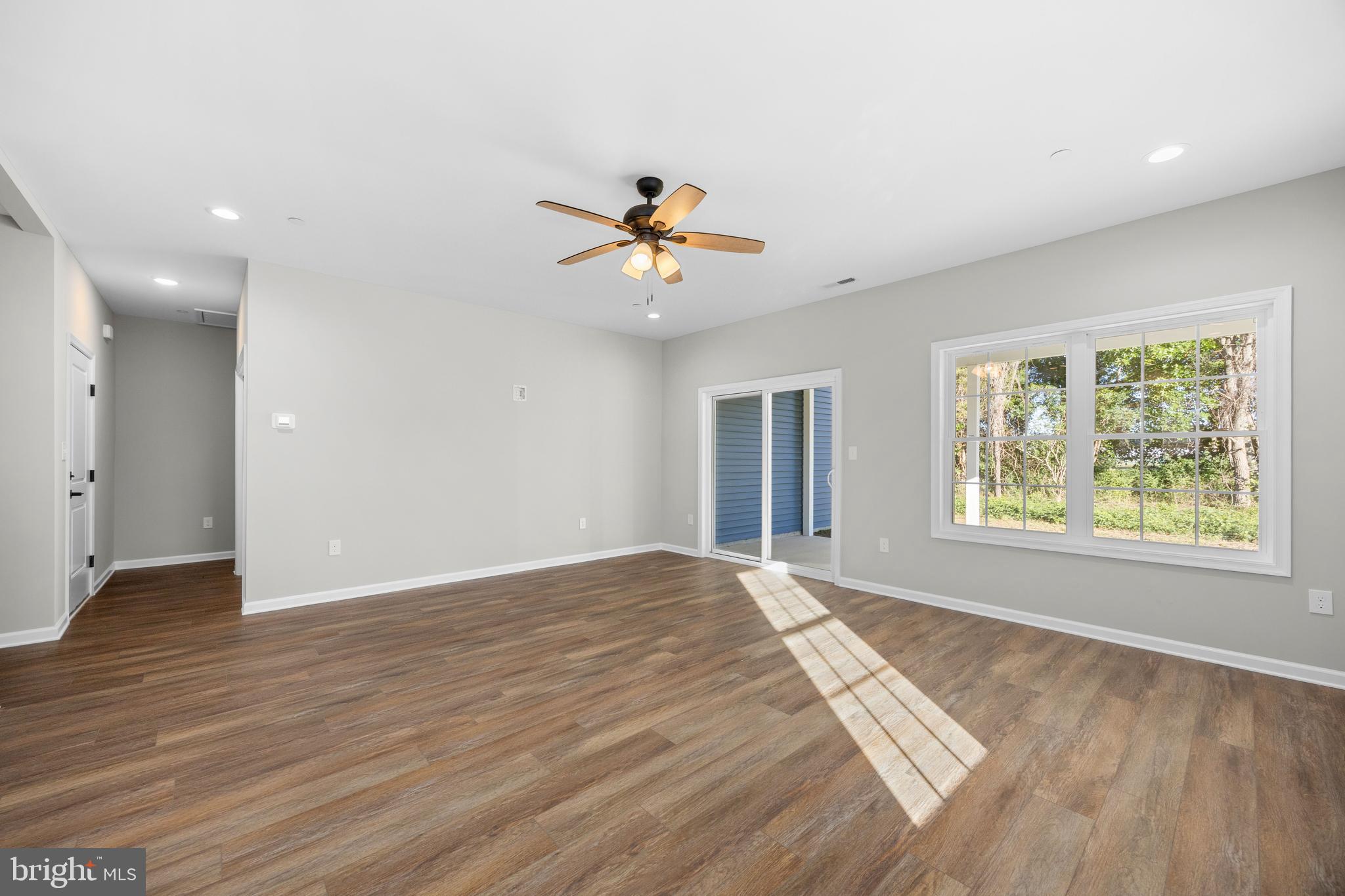 11775 St Stephens Way Princess Anne, MD 21853 - Photo 12 of 51 an empty room with wooden floor and windows