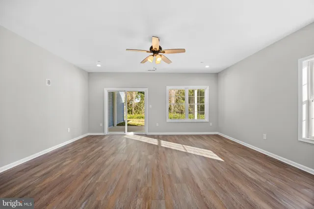 a white kitchen with granite countertop white cabinets and a granite counter tops
