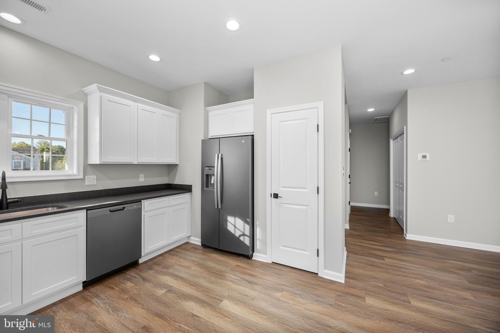 11775 St Stephens Way Princess Anne, MD 21853 - Photo 16 of 51 a kitchen with stainless steel appliances granite countertop a refrigerator and a sink