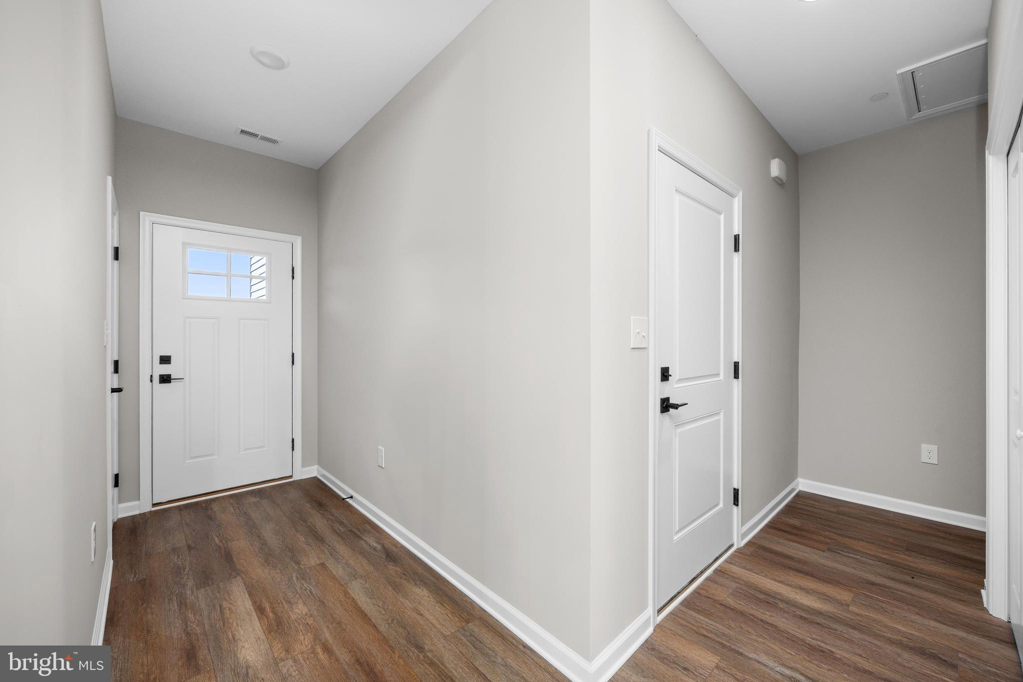 11775 St Stephens Way Princess Anne, MD 21853 - Photo 19 of 51 a view of a hallway with wooden floor