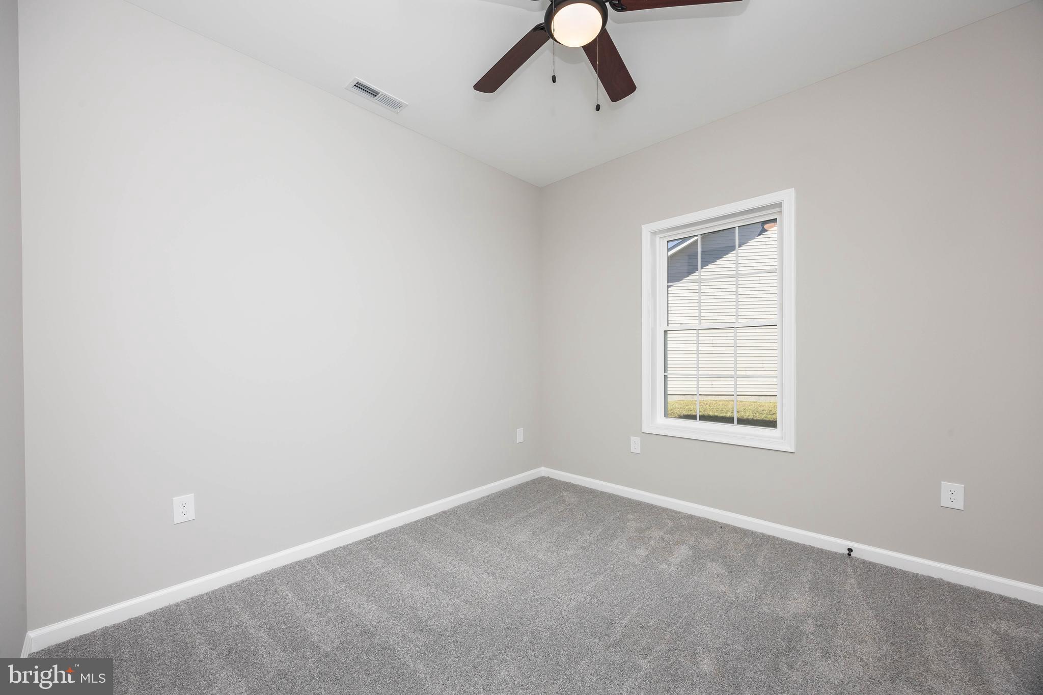 11775 St Stephens Way Princess Anne, MD 21853 - Photo 20 of 51 an empty room with a window and ceiling fan