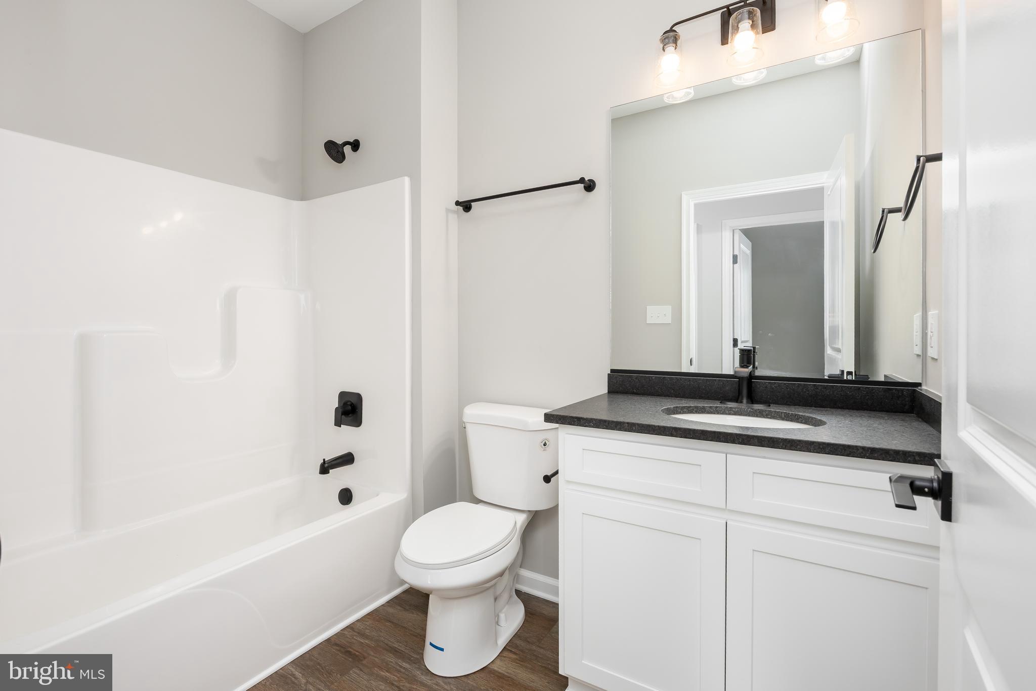 11775 St Stephens Way Princess Anne, MD 21853 - Photo 24 of 51 a bathroom with a sink a toilet and a bathtub