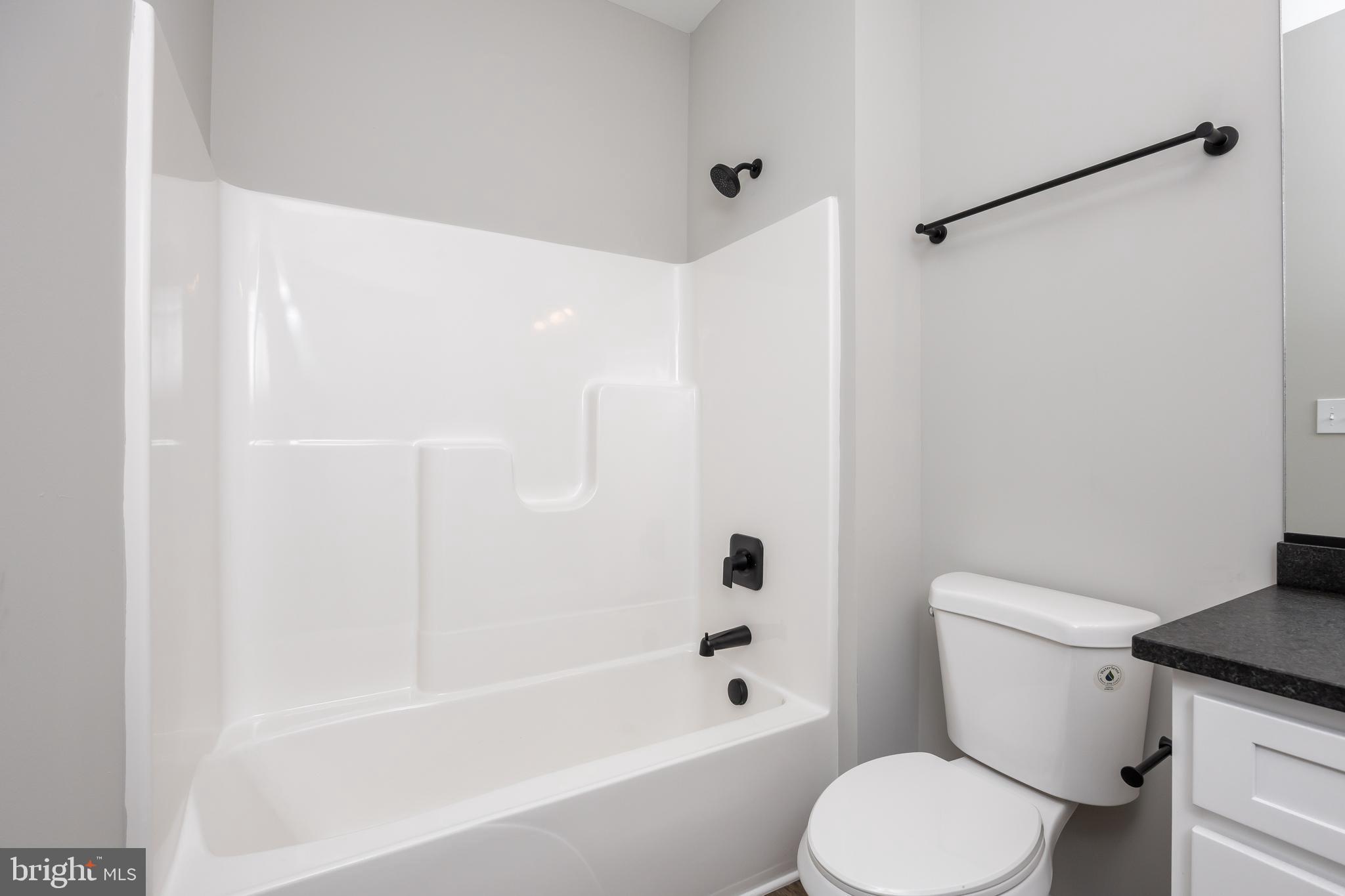 11775 St Stephens Way Princess Anne, MD 21853 - Photo 25 of 51 a white toilet sitting next to a bath tub