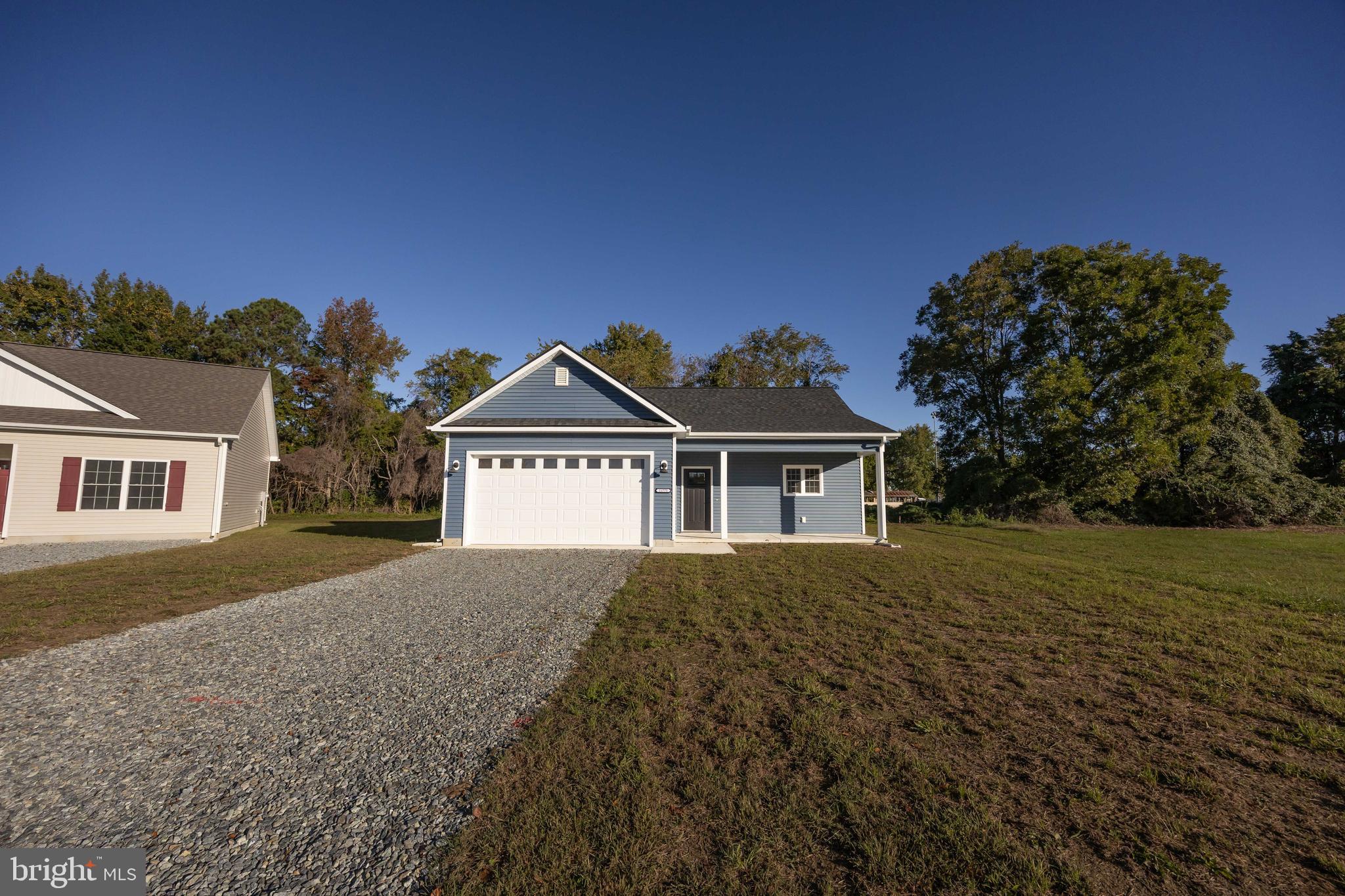 11775 St Stephens Way Princess Anne, MD 21853 - Photo 3 of 51 front view of a house with a yard