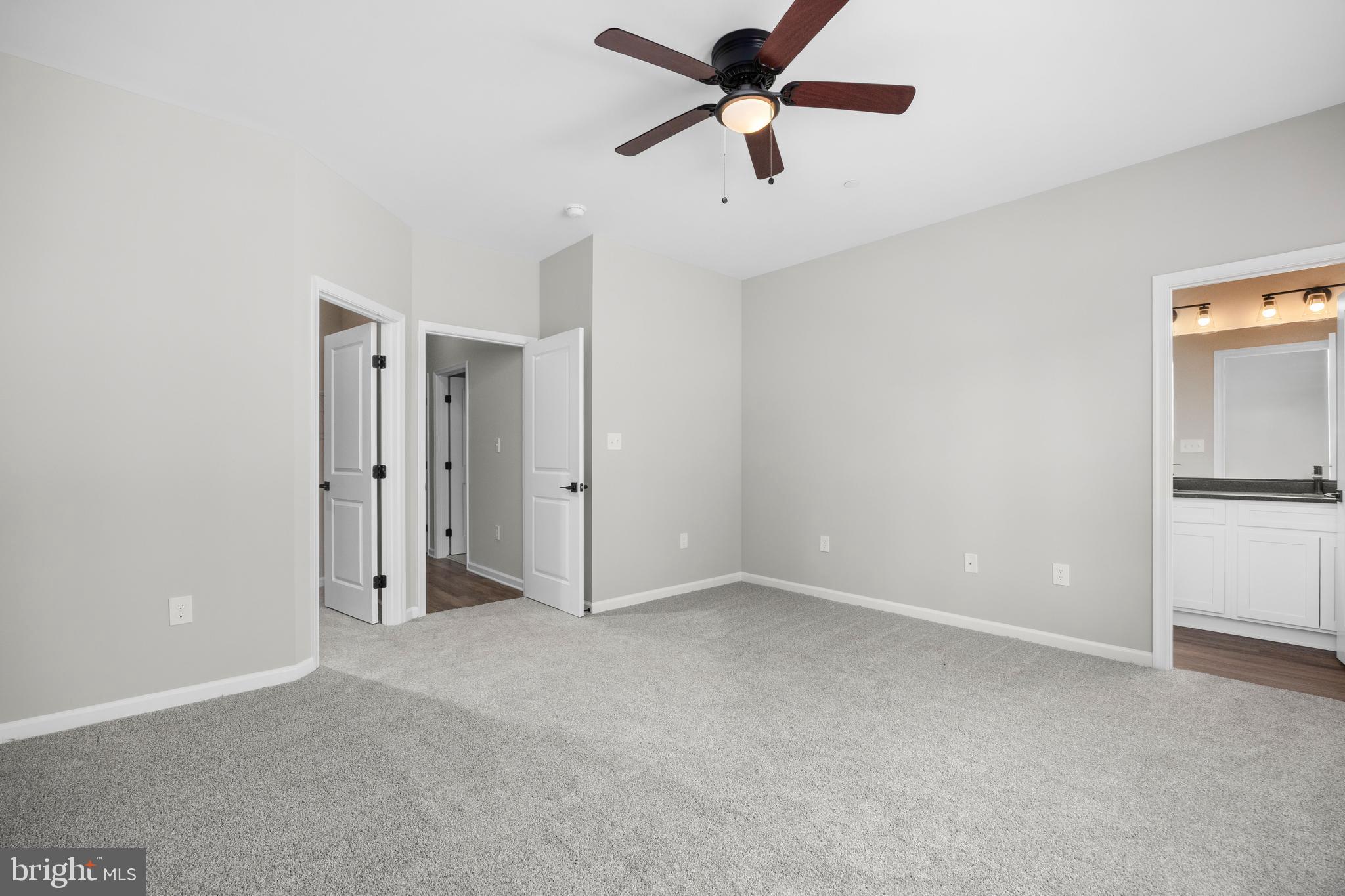 11775 St Stephens Way Princess Anne, MD 21853 - Photo 32 of 51 an empty room with closet and a ceiling fan