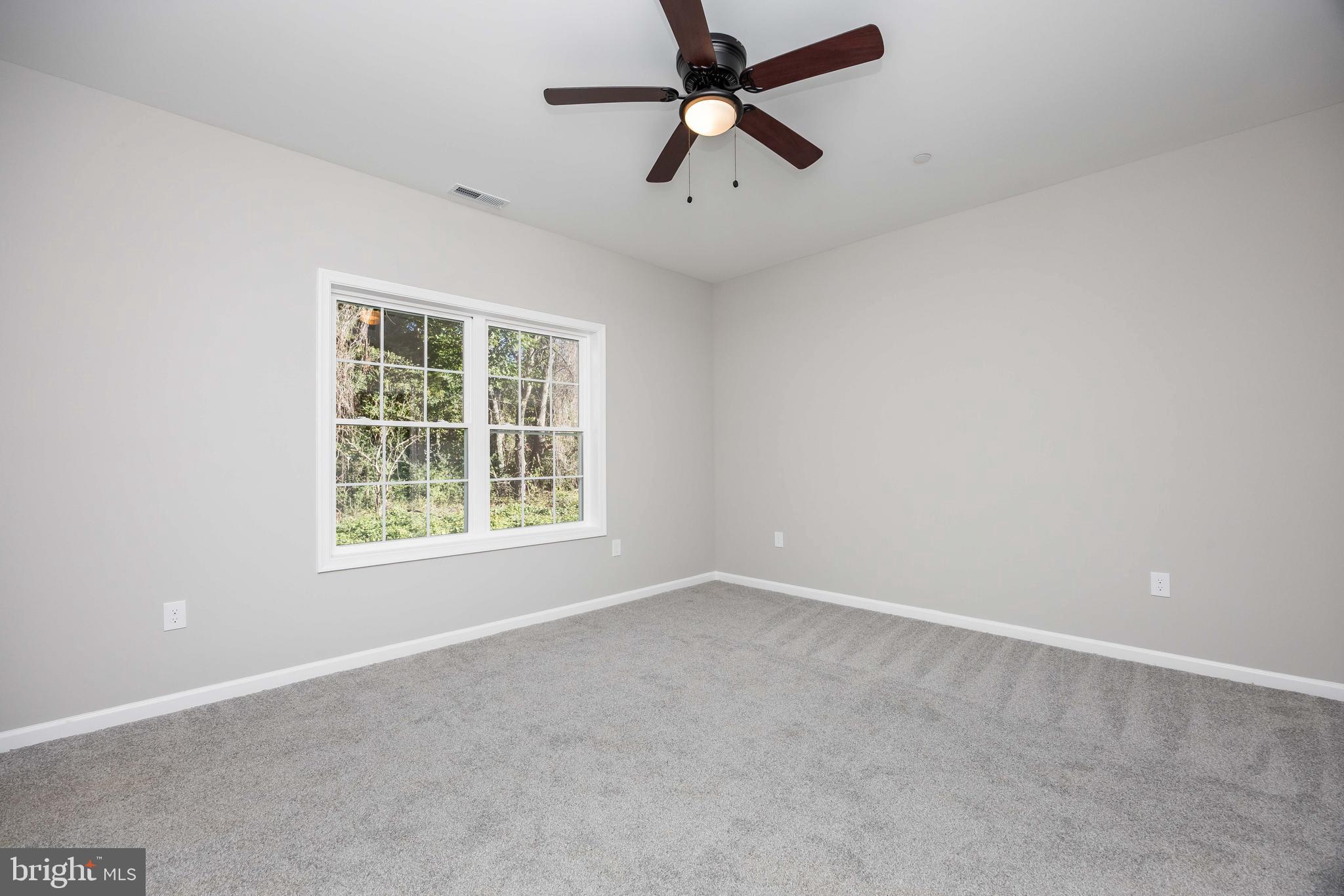 11775 St Stephens Way Princess Anne, MD 21853 - Photo 34 of 51 an empty room with a window and a fan