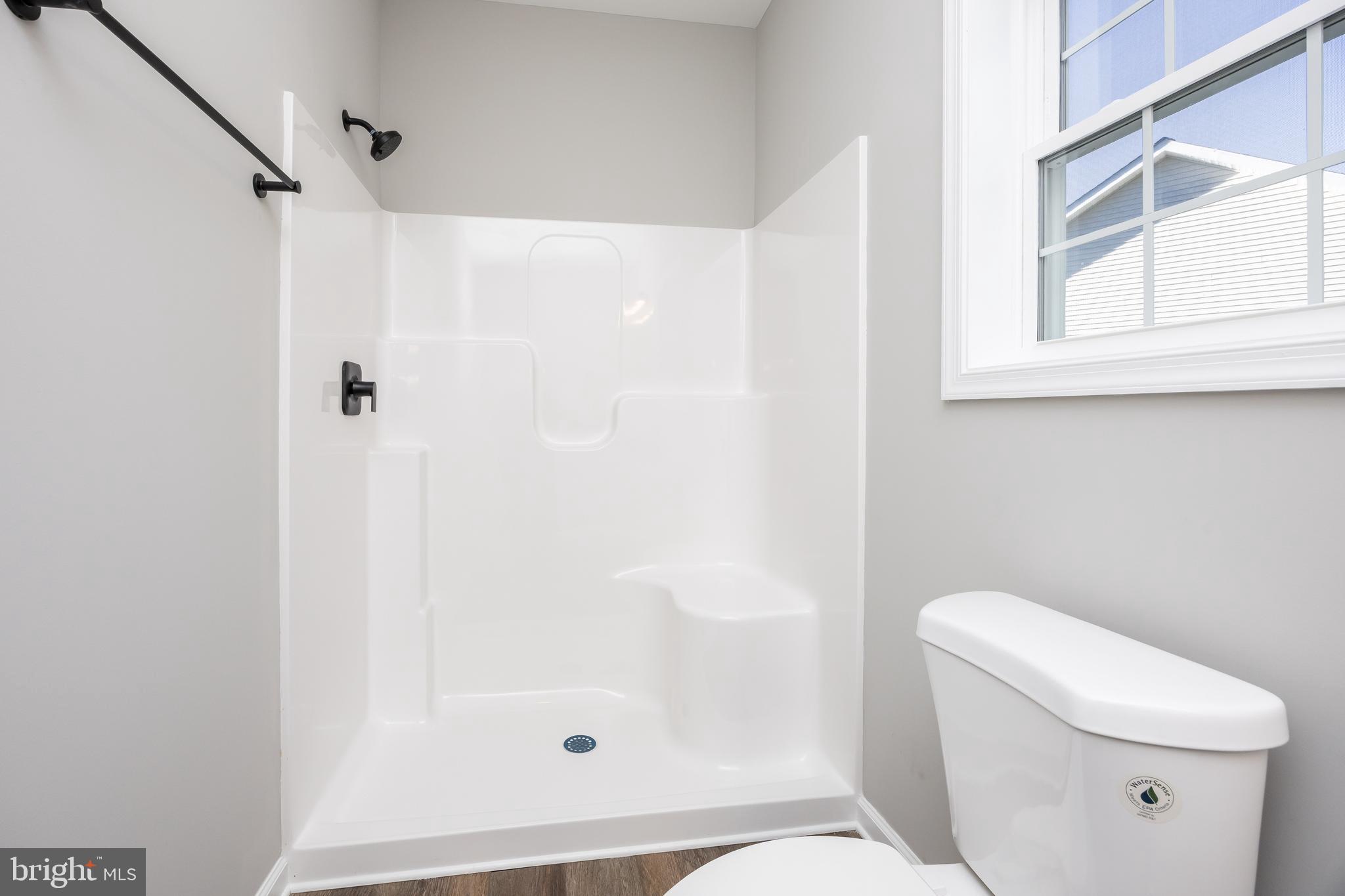 11775 St Stephens Way Princess Anne, MD 21853 - Photo 37 of 51 a white toilet sitting next to a bathroom sink