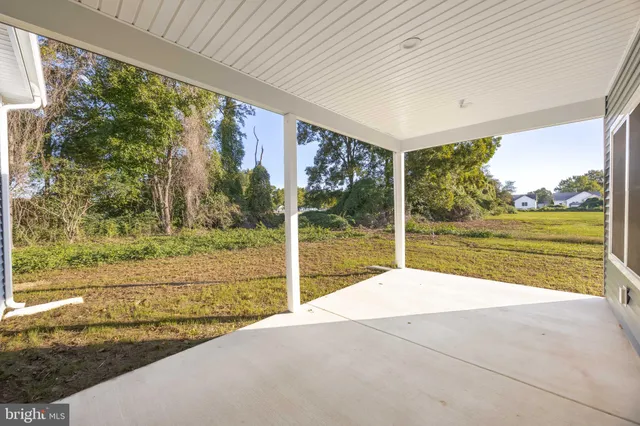 a view of backyard with large windows