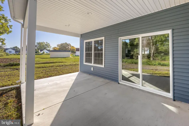 a view of backyard with large windows
