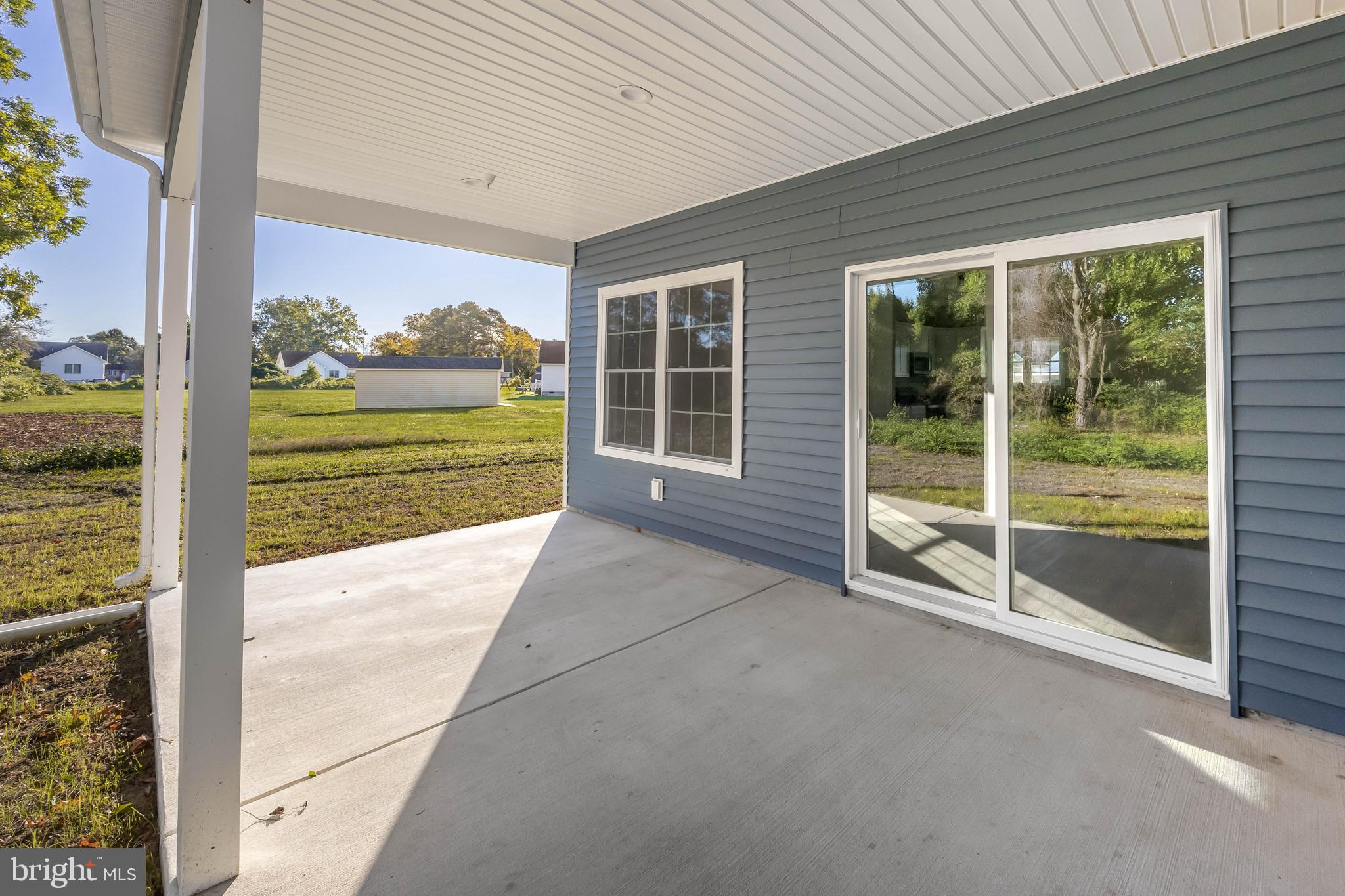 11775 St Stephens Way Princess Anne, MD 21853 - Photo 44 of 51 a view of backyard with large windows