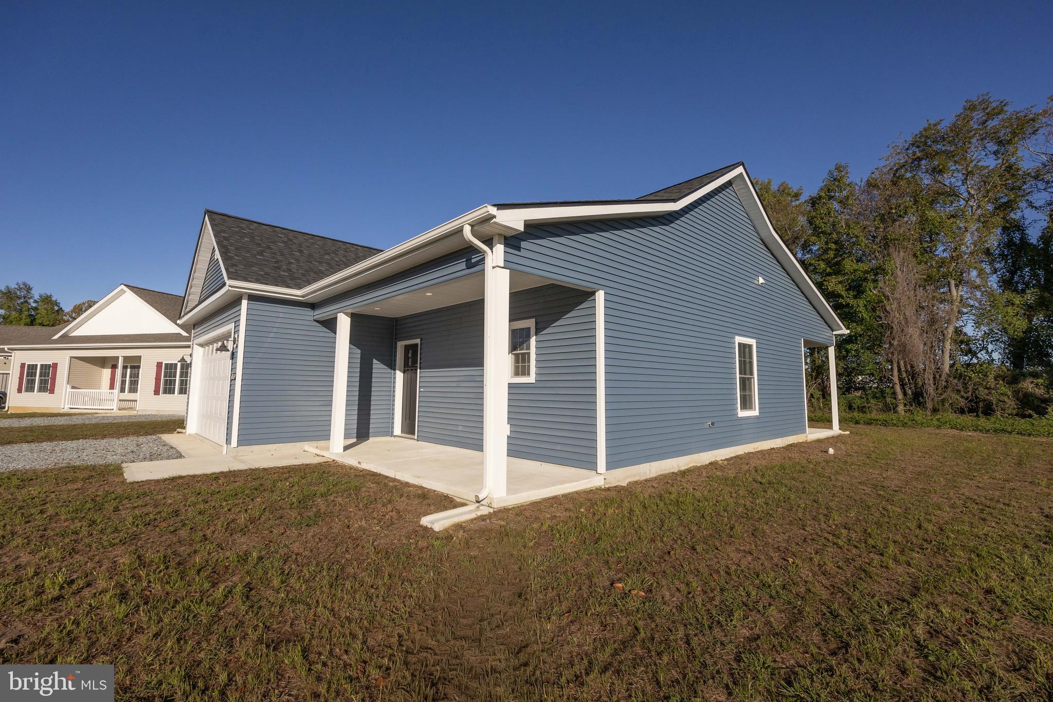 11775 St Stephens Way Princess Anne, MD 21853 - Photo 8 of 51 a front view of a house with a yard