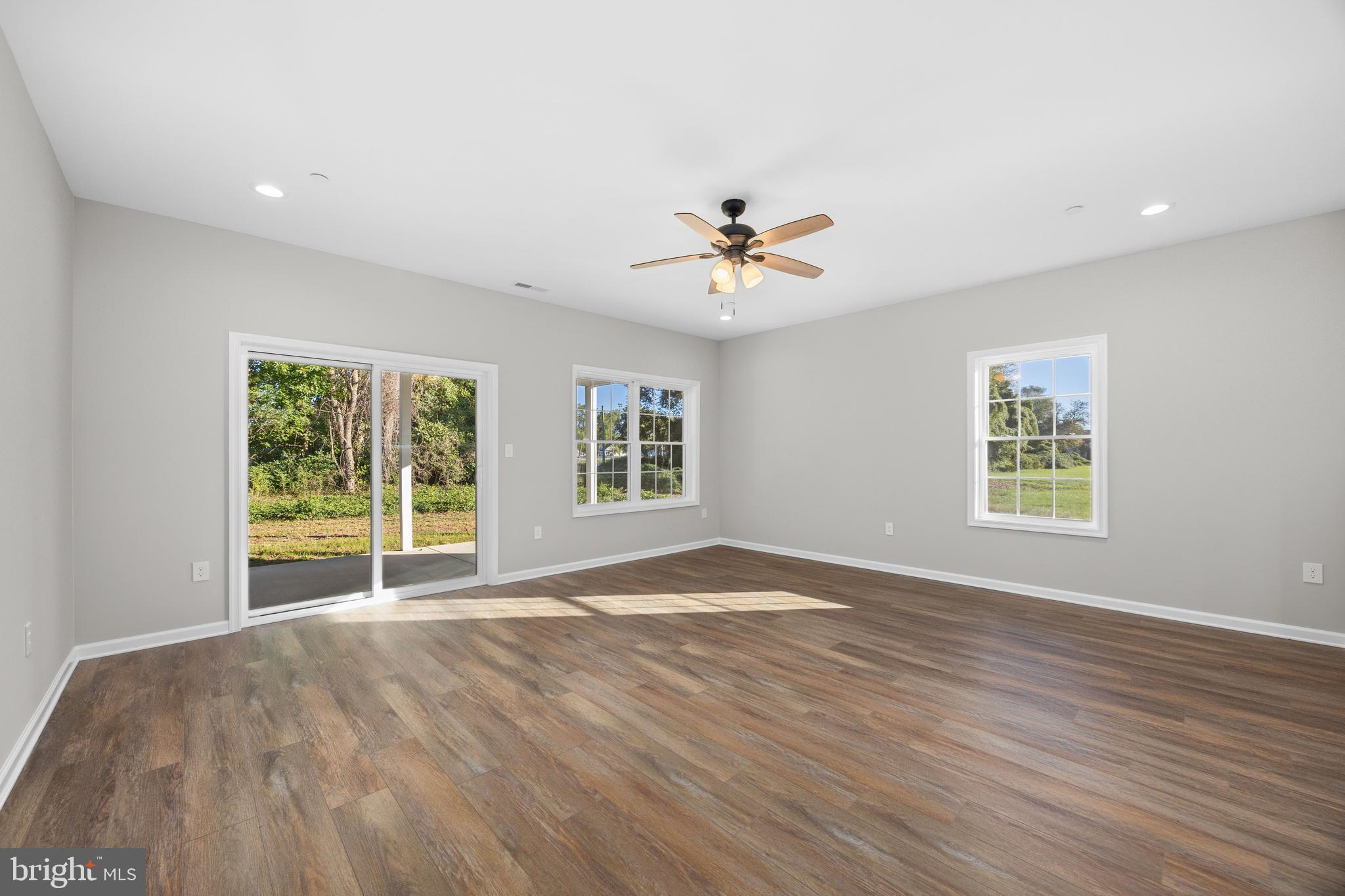 11775 St Stephens Way Princess Anne, MD 21853 - Photo 9 of 51 a view of an empty room with a window and a ceiling fan